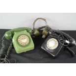 A black bakelite and green bakelite telephone and RAF headset.