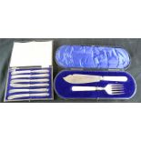 A set of six silver handled butter knives, and a boxed fish set.