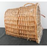 A wicker cat carrier.