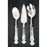 Three Waterford crystal servers; slice, fork and spoon.