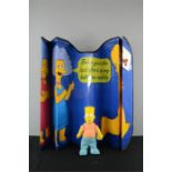 A Bart Simpson tag and windscreen shield.