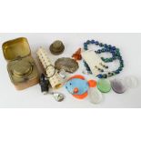 A miscellaneous group of items to include an antique inkwell, malachite beaded necklace set, glass