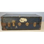 A vintage travelling trunk with lined interior.