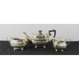 A silver part tea service, Birmingham 1904, comprising tea pot, slop bucket, milk jug, total