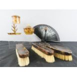 A group of bakelite faux tortoiseshell dressing table items.