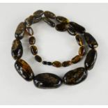 An amber necklace, graduated beads.