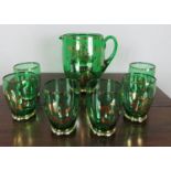 A green gilt water set including jug and six glasses.