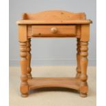 A small pine side table / child's desk with single drawer.