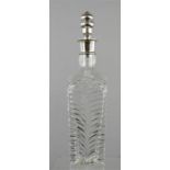 A late Victorian cut glass crystal decanter with wishbone design, with silver plated stopper and