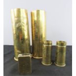 A group of brass trench art; two large and two small shell cases, together with a German 1914 trench