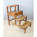 A set of library steps in pine, with leather treads.