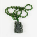 A Chinese Heitian Hunan nephrite jade pendant of a carved Buddha with beaded necklace.