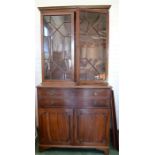 A 19th century secretaire bookcase, the upper glazed doors with astrigal decoration enclosing