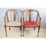 A pair of mahogany Edwardian armchairs.