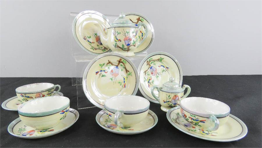 A child’s lustre tea set.