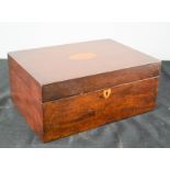 A Victorian mahogany work box, with silk lined fitted interior, inlaid with an oval motif to the top