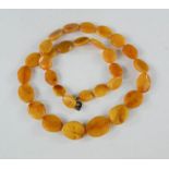 A polished amber necklace.