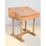 A pine childs desk, with slope lid.