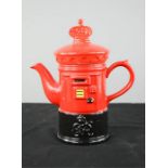 A tea pot in the form of a Royal Mail letter box.