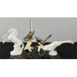 A porcelain Lladro goose, a Karl Ens bird, and two other figures.