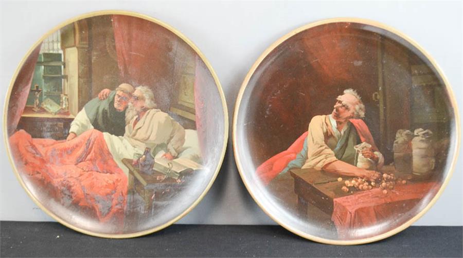 A pair of terracotta Watcombe Torquay 1084 roundel wall plaque, painted with man in the counting