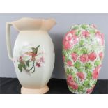 A large Edwardian painted blush ivory jug together with a vintage floral baluster vase.