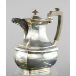 A silver tea pot.