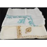 Two embroidered shawls, one with gold thread.