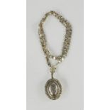 A silver locket and chain, 2.35toz.