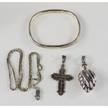 A group of silver to include bangle, scent bottle pendant, filigree crucifix pendant etc.