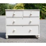 A pine white painted chest of drawers.