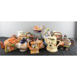 A large group of tea pots of various style and form.