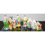 A group of eight Chinese hand painted scent bottles, one erotic.