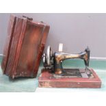 A Singer sewing machine and case.