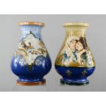 A similar pair of stone glazed Italian vases; one depicting an owl, the other with mother and