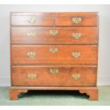 An 18th century oak chest of drawers, two short over three long graduated drawers, raised on bracket