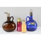 A group of antique glassware to include a blue glass bottle bearing Brandy tag, a brown glass bottle