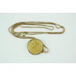 A gold half sovereign, with 9ct gold mount and chain. 9.2g