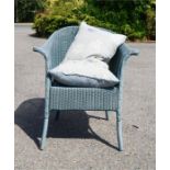 A blue Lloyd Loom armchair with two cushions, Lloyd Loom label to the base.