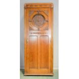 A Scottish oak Arts & Crafts single wardrobe. 189 by 74 by 37½cm