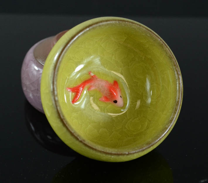 A pair of ceramic dishes modelled with goldfish to the interior, in purple and green glaze, 2½ - Image 3 of 3