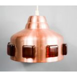 An Einar Backstrom pendant light, in rose gold brushed finish inset with square cabochons.