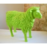 A life-size model sheep in bright green, 60 by 72 by 23cm.