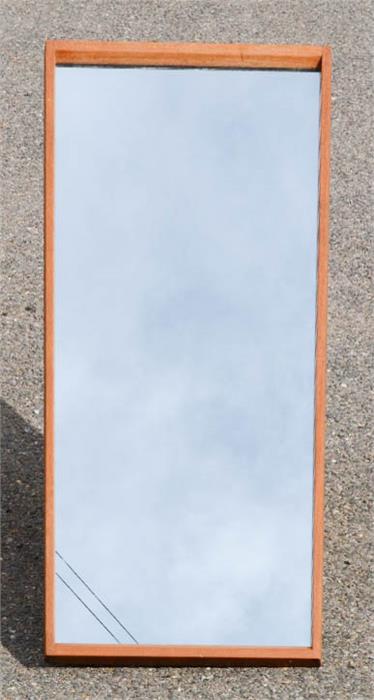 A Danish teak wall mirror, 80 by 36cm.