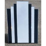 An Art Deco style mirror, with bevelled glass panels.