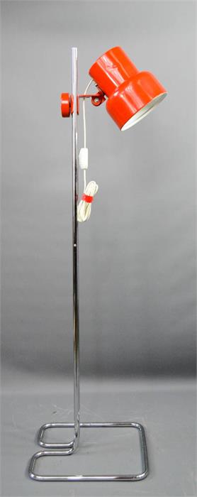 A red and chrome floor lamp in the manner of Anders Pehrson.