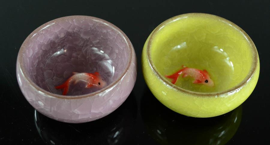 A pair of ceramic dishes modelled with goldfish to the interior, in purple and green glaze, 2½ - Image 2 of 3