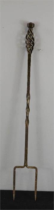 A cast iron toasting fork.