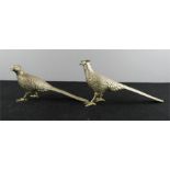 A pair of metal pheasants.