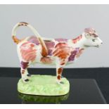 A Staffordshire cow creamer circa 1880, 19cm long.